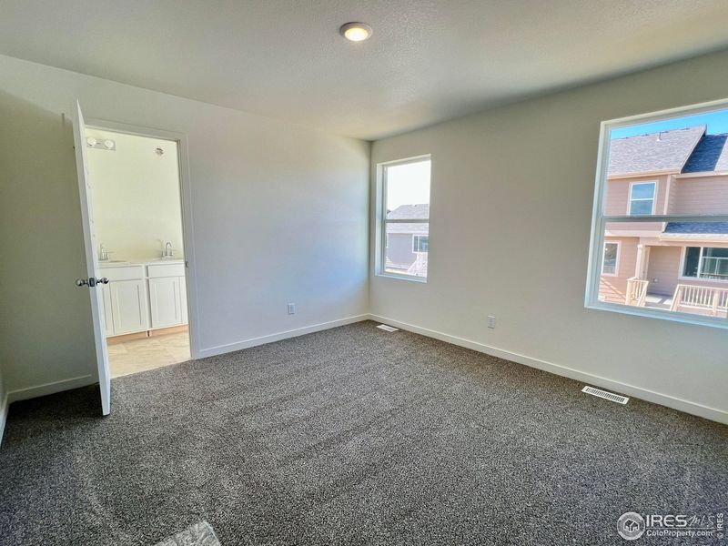 Spacious, unfurnished interior of a new home in Union Colony West, Greeley (Image 17).