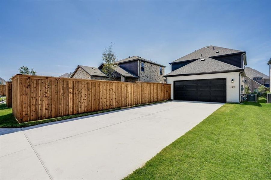 Front exterior of a new home in North Sky Celina, Celina, TX, highlighting curb appeal (Image 22). Front exterior of a new home in North Sky Celina, Celina, TX, highlighting curb appeal (Image 22).