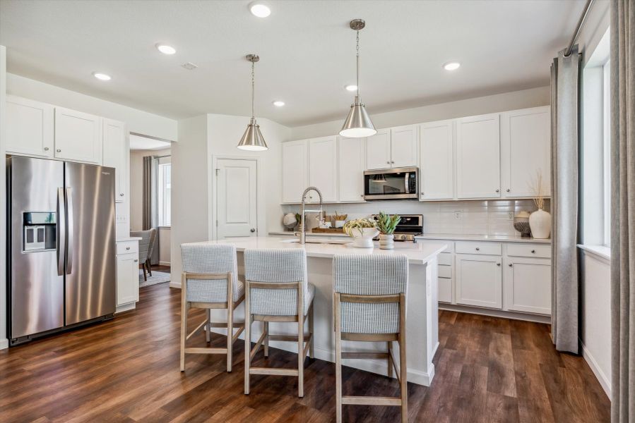 A kitchen with white cabinets. A kitchen with white cabinets.
