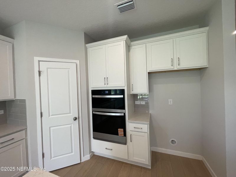 Furnished interior view inside a new home in The Magnolia Series at Reserve East, Flagler Beach (Image 7).