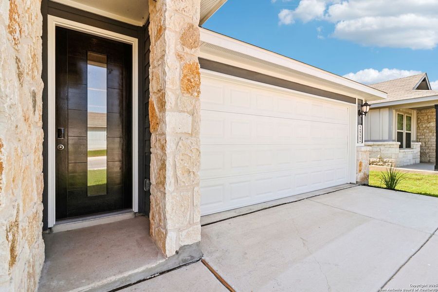 Front exterior of a new home in Catalina, Converse, TX, highlighting curb appeal (Image 25).