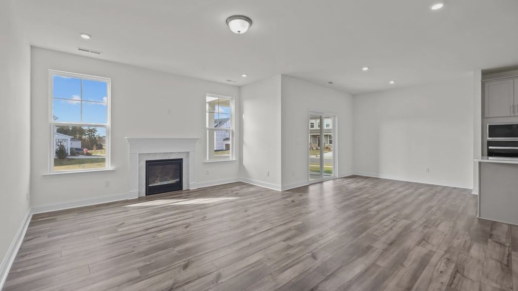 Fairfield design open concept family room, eat-in breakfast area, and gourmet kitchen at Lakeside Glen by DRB Homes, York, SC