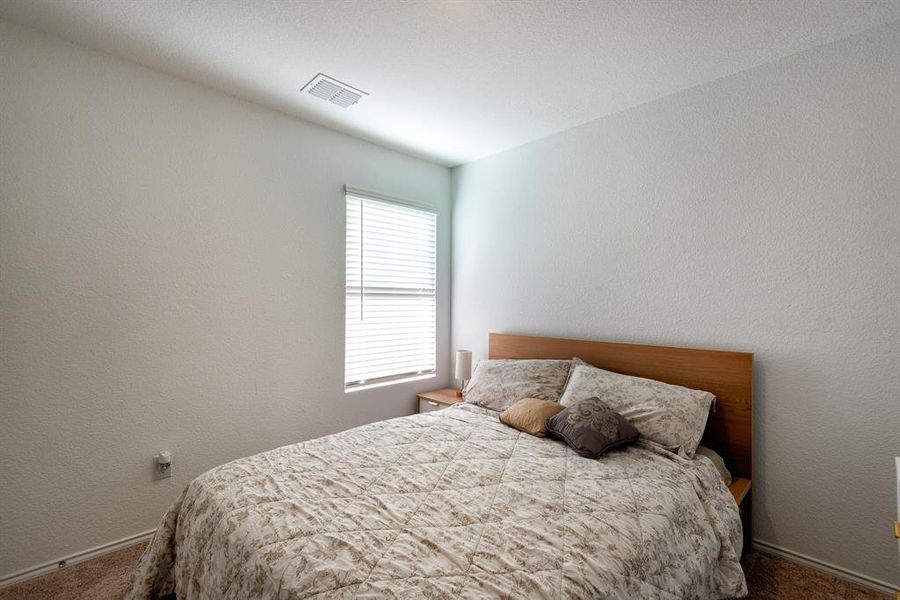 Bedroom featuring carpet floors