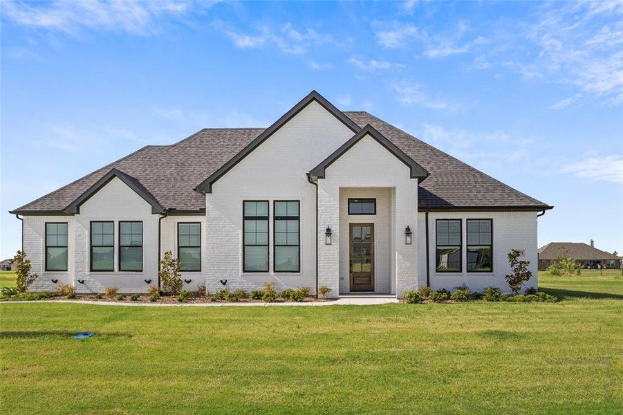 View of front of home featuring a front lawn