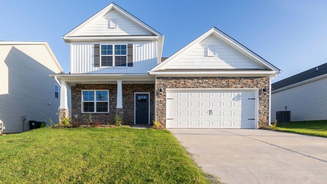 Front exterior of a new home in Cambridge Park, Mebane, NC, highlighting curb appeal (Image 1). Front exterior of a new home in Cambridge Park, Mebane, NC, highlighting curb appeal (Image 1).