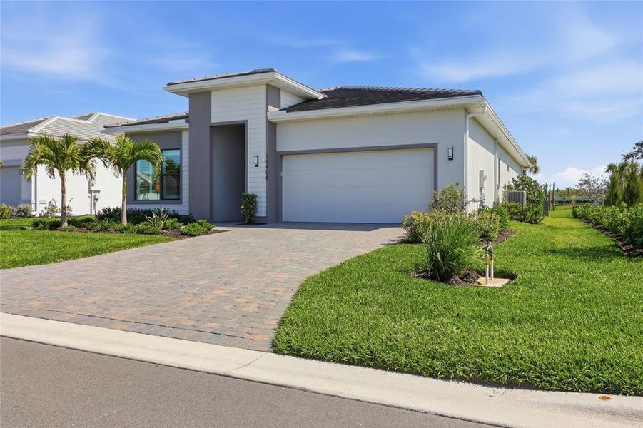 Front exterior of a new home in , Lakewood Ranch, FL, highlighting curb appeal (Image 21). Front exterior of a new home in , Lakewood Ranch, FL, highlighting curb appeal (Image 21).