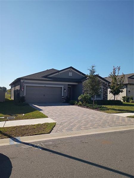 Front exterior of a new home in Avalon West, Spring Hill, FL, highlighting curb appeal (Image 1). Front exterior of a new home in Avalon West, Spring Hill, FL, highlighting curb appeal (Image 1).