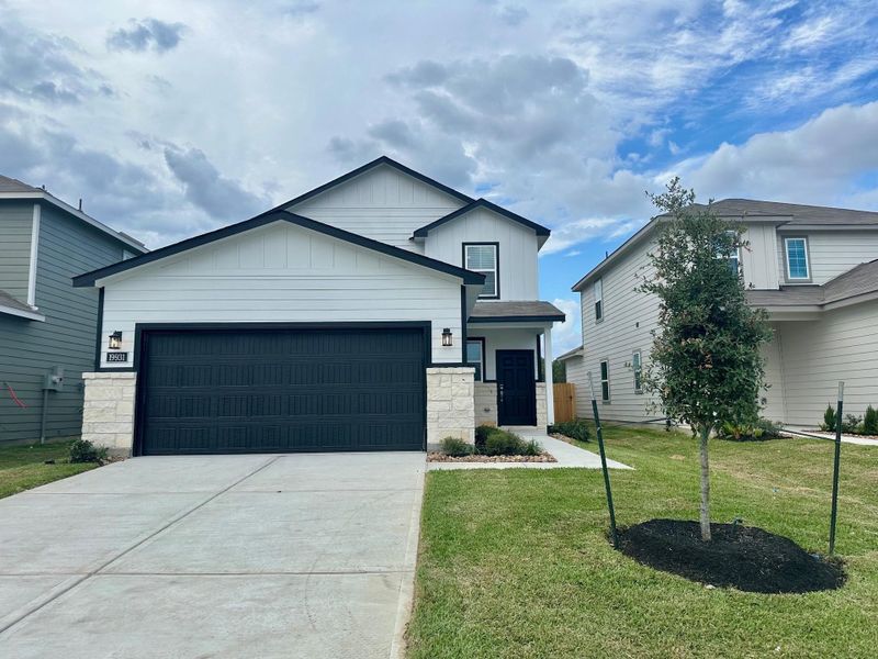 Front exterior of a new home in Northpark South, Porter, TX, highlighting curb appeal (Image 2). Front exterior of a new home in Northpark South, Porter, TX, highlighting curb appeal (Image 2).
