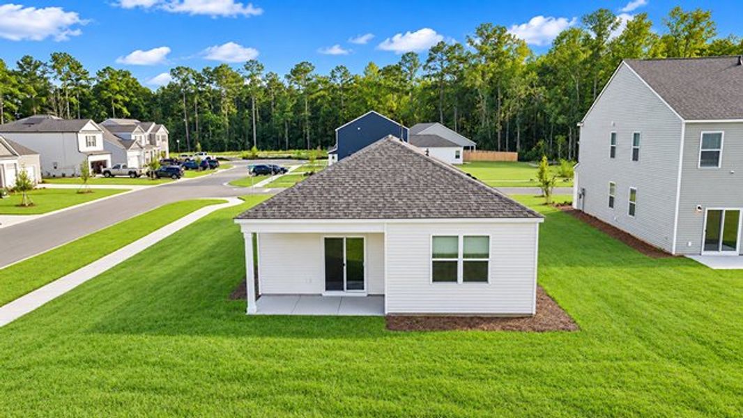 Exterior details and patio area of a home in Pine Hills at Cane Bay, Summerville (Image 3).