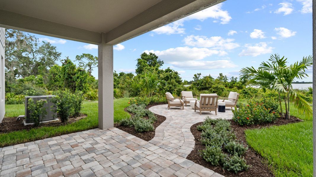 Representative exterior photo of a completed home built from the Ponte Verde by DRB Homes in Willowbrook North, Winter Haven, FL (Image 25). Representative exterior photo of a completed home built from the Ponte Verde by DRB Homes in Willowbrook North, Winter Haven, FL (Image 25).