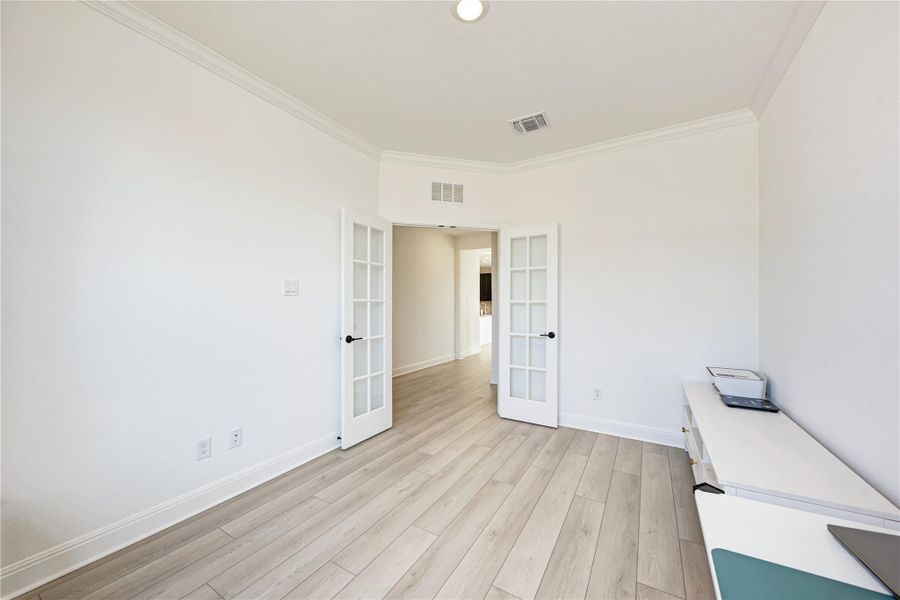 Bright interior space featuring light wood-finish flooring