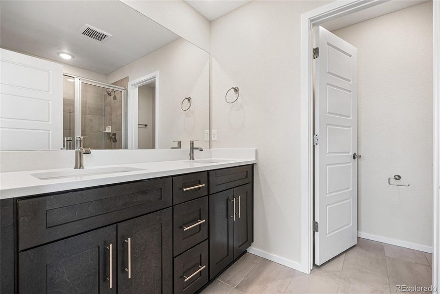Furnished interior view inside a new home in Barefoot Village, Firestone (Image 9).
