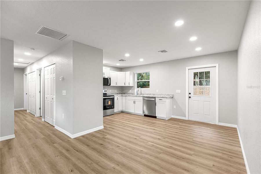 Spacious, unfurnished interior of a new home in , Fort McCoy (Image 9).