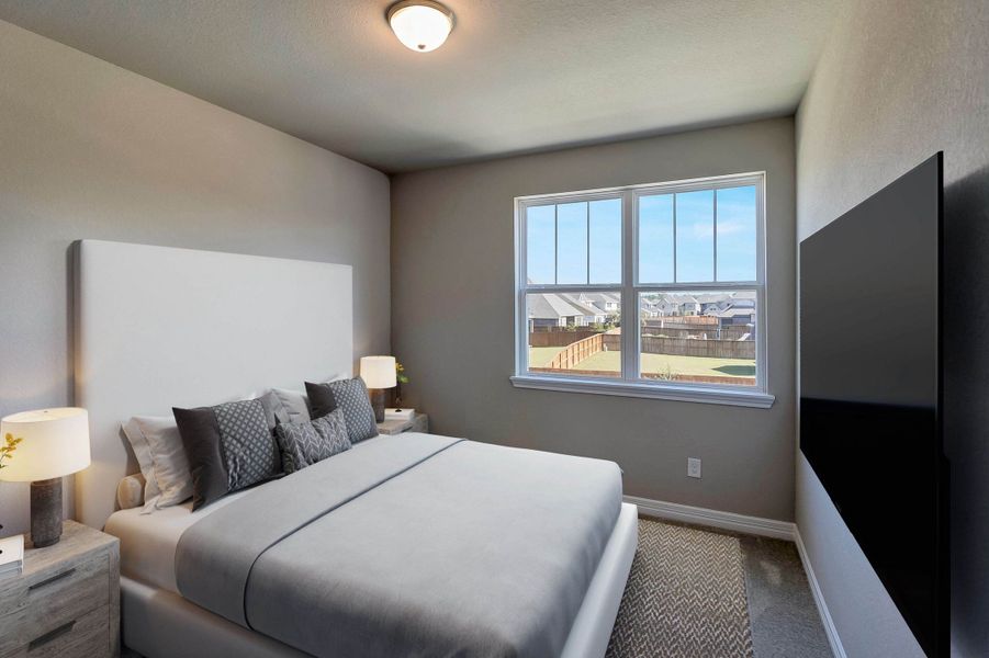 Secondary bedroom. Note: Sample product photo - actual exterior and interior selections may vary by homesite