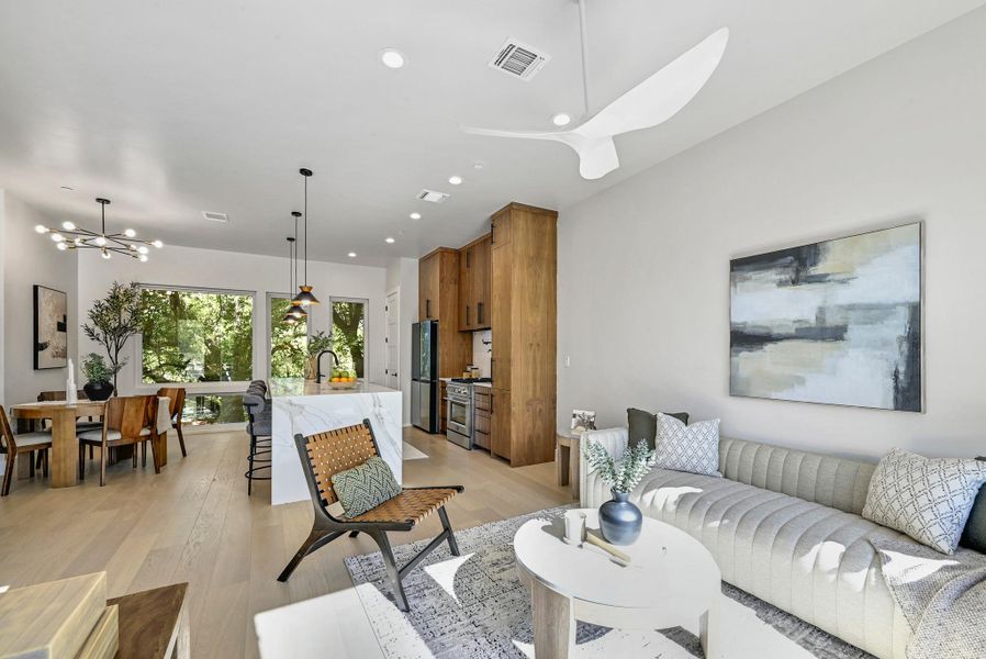 2nd Floor Open Living area with plenty of space for seating. (This is Unit #2 - each Unit has the same layout, however a few differing details such as light fixtures, custom cabinet/backsplash/tile colors)