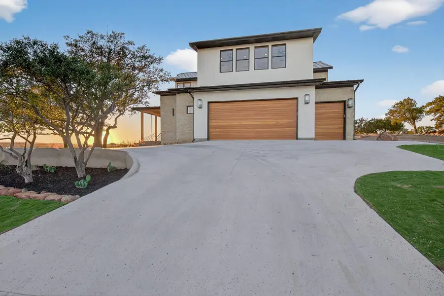 Front exterior of a new home in , Horseshoe Bay, TX, highlighting curb appeal (Image 1).
