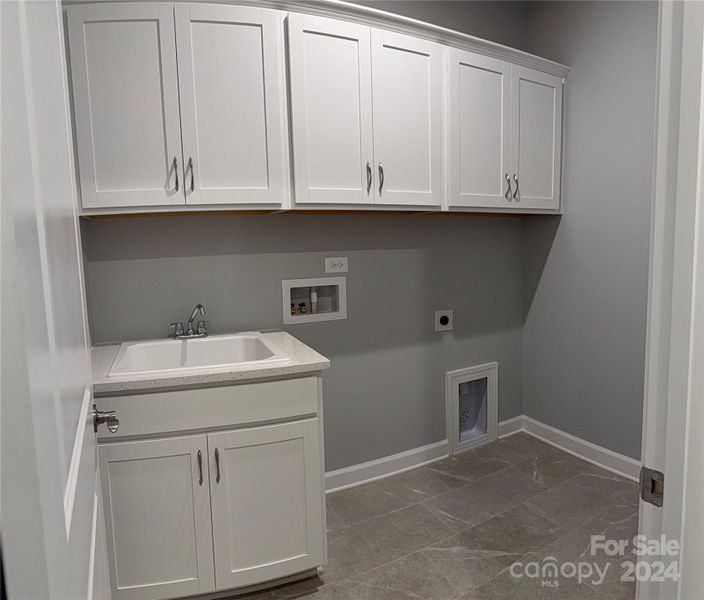 Sink and Cabinets in Laundry Room