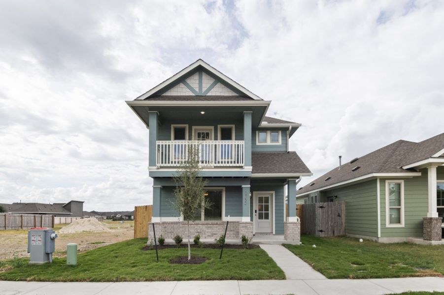 Front exterior of a new home in Blanco Vista, San Marcos, TX, highlighting curb appeal (Image 12).
