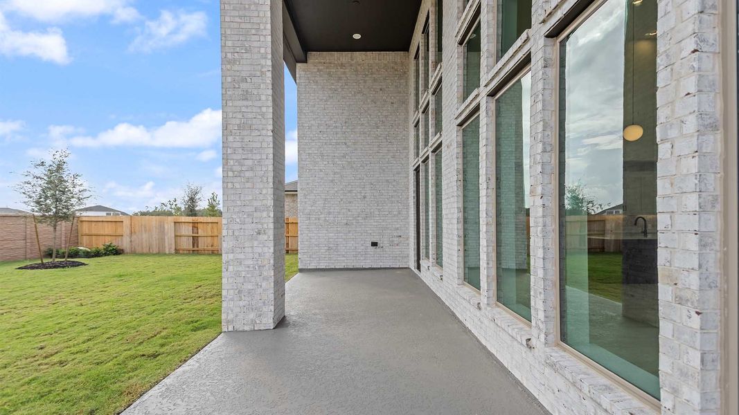 Exterior details and patio area of a home in Lakes of Cane Island, Katy (Image 3).