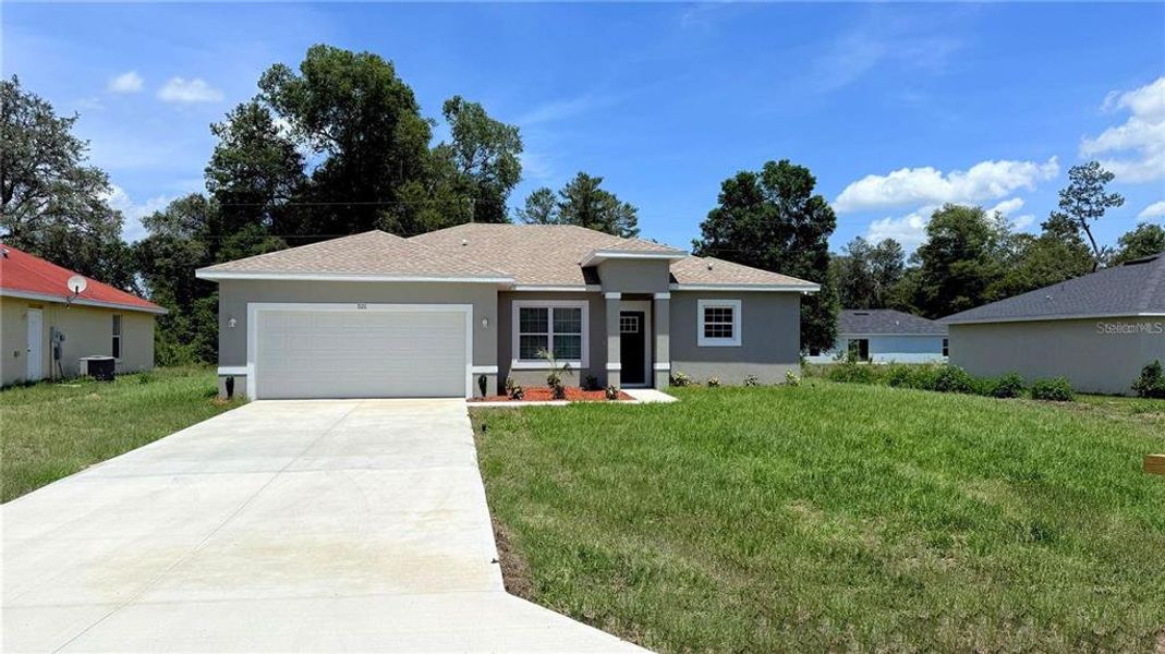 Front exterior of a new home in , Ocala, FL, highlighting curb appeal (Image 1). Front exterior of a new home in , Ocala, FL, highlighting curb appeal (Image 1).
