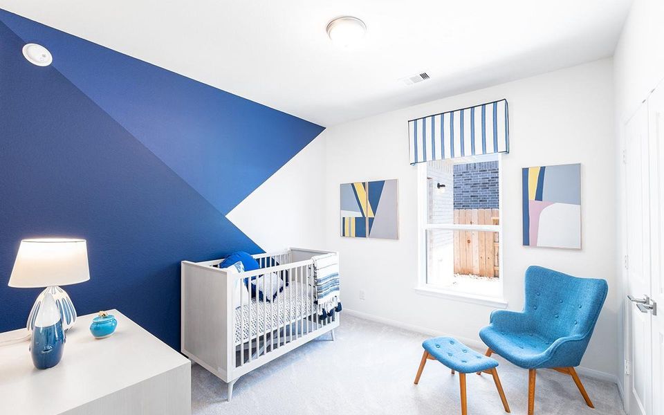 Bedroom with carpet floors and baseboards Bedroom with carpet floors and baseboards