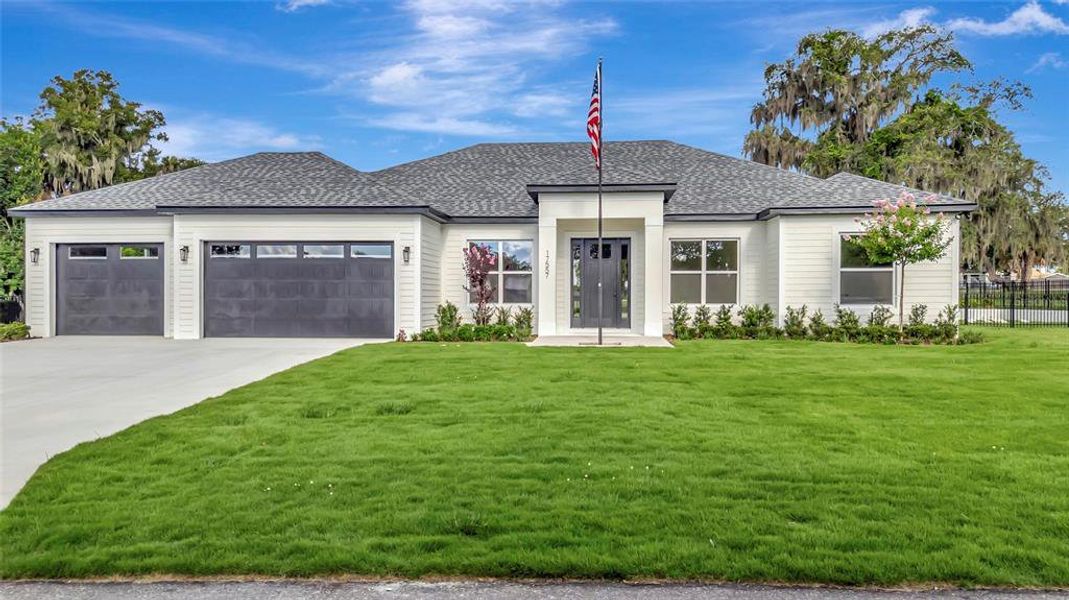 Front exterior of a new home in , Montverde, FL, highlighting curb appeal (Image 2). Front exterior of a new home in , Montverde, FL, highlighting curb appeal (Image 2).