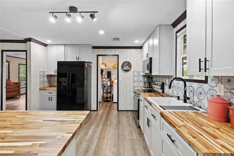 Furnished interior view inside a new home in , Okeechobee (Image 28).