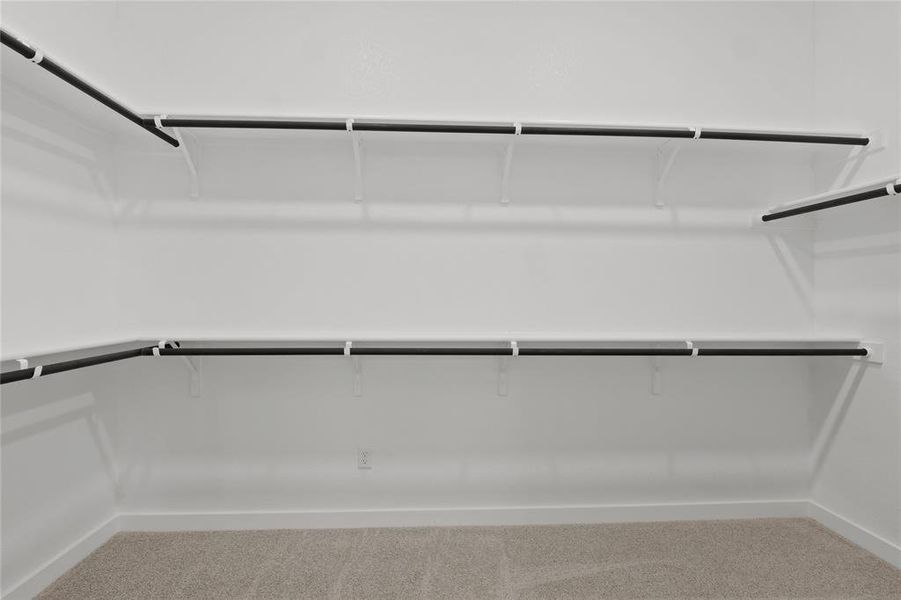 Primary Closet in the Pecan II home plan by Trophy Signature Homes – REPRESENTATIVE PHOTO Primary Closet in the Pecan II home plan by Trophy Signature Homes – REPRESENTATIVE PHOTO