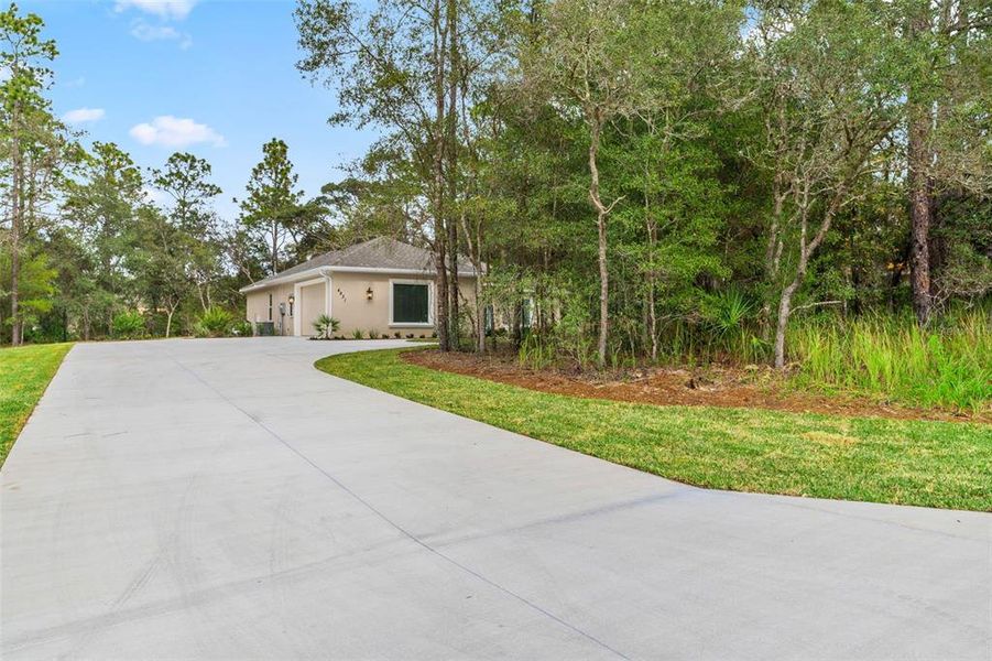 Front exterior of a new home in , Beverly Hills, FL, highlighting curb appeal (Image 1).