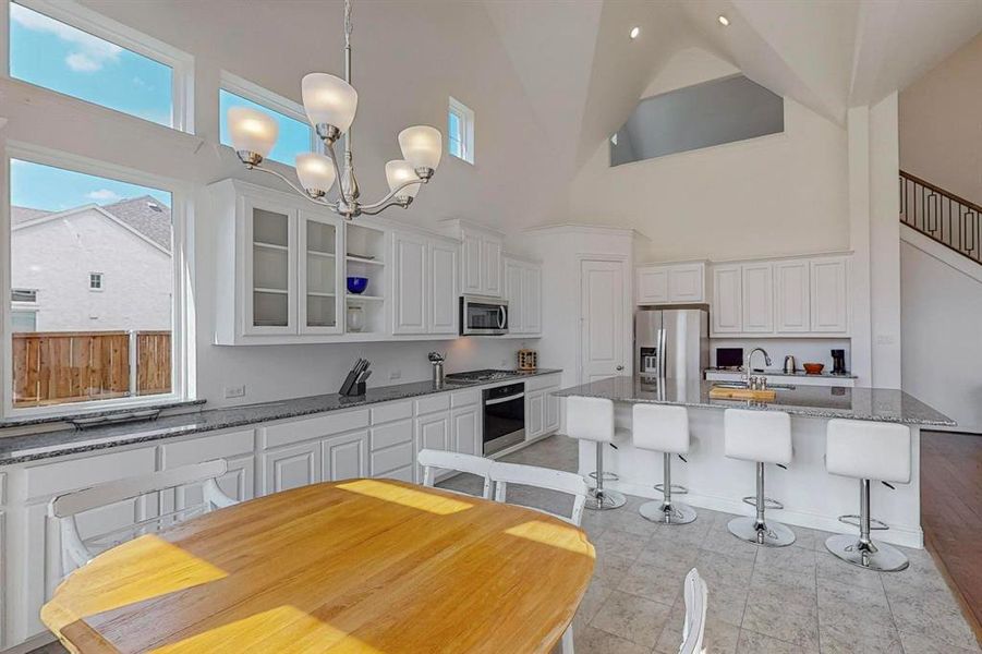 Another view of the fully built out Kitchen with wall to wall cabinets and enough space to satisfy all your storage needs!