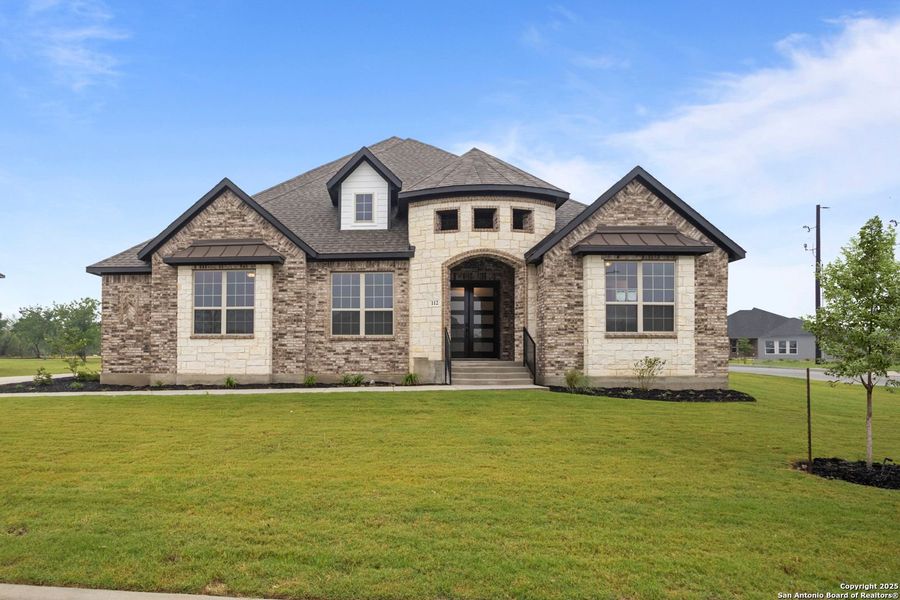 Front exterior of a new home in Potranco Oaks, Castroville, TX, highlighting curb appeal (Image 35).