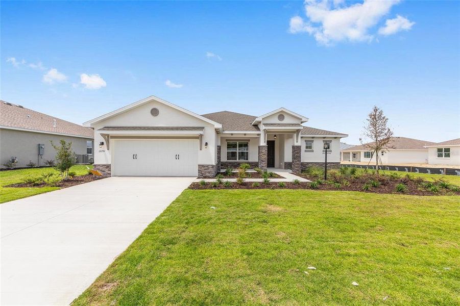 Front exterior of a new home in , Ocala, FL, highlighting curb appeal (Image 18). Front exterior of a new home in , Ocala, FL, highlighting curb appeal (Image 18).