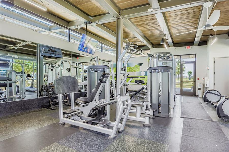 Workout area with beamed ceiling