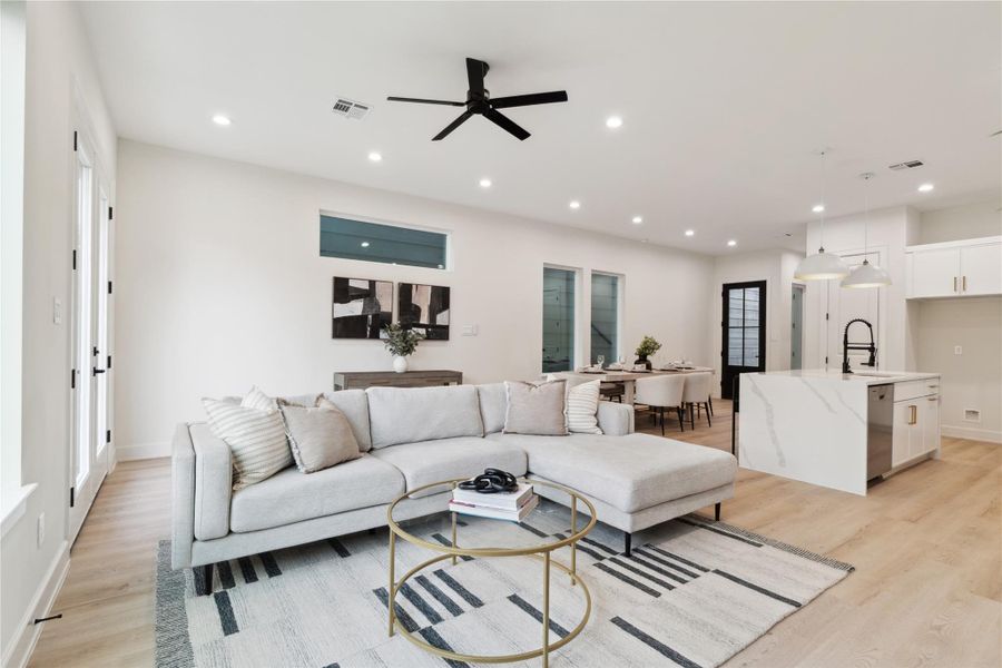 Luxury vinyl flooring flows throughout the home, combining sleek style with durable construction. This modern touch enhances both beauty and practicality in every room.