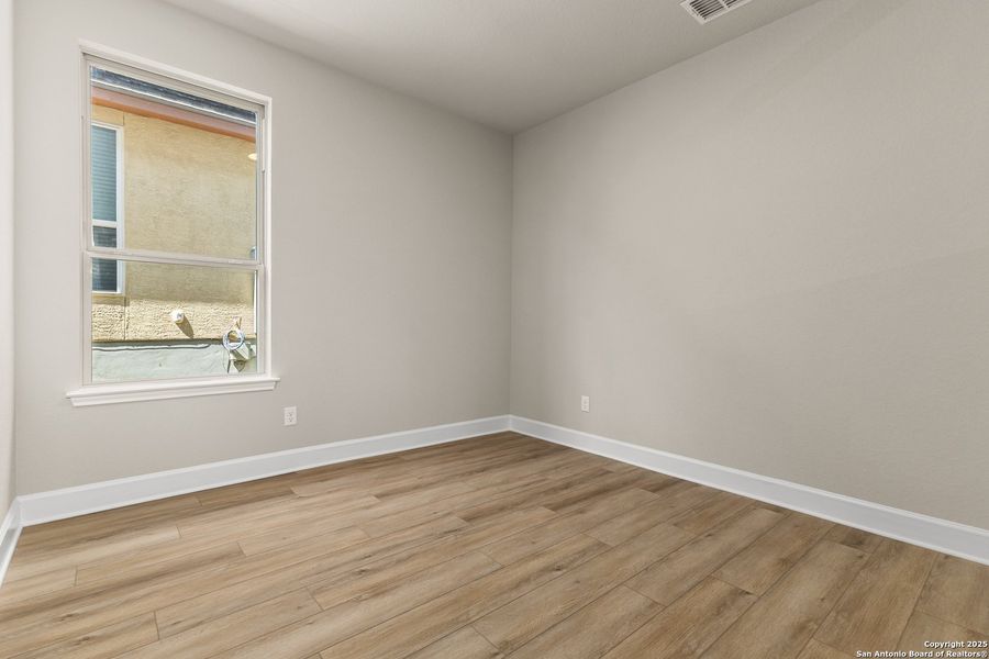 Spacious, unfurnished interior of a new home in The Enclave at Potranco Oaks, Castroville (Image 25).