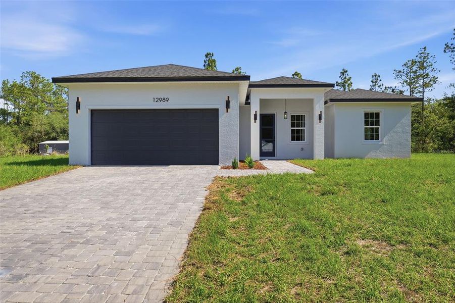 Front exterior of a new home in , Ocala, FL, highlighting curb appeal (Image 19).
