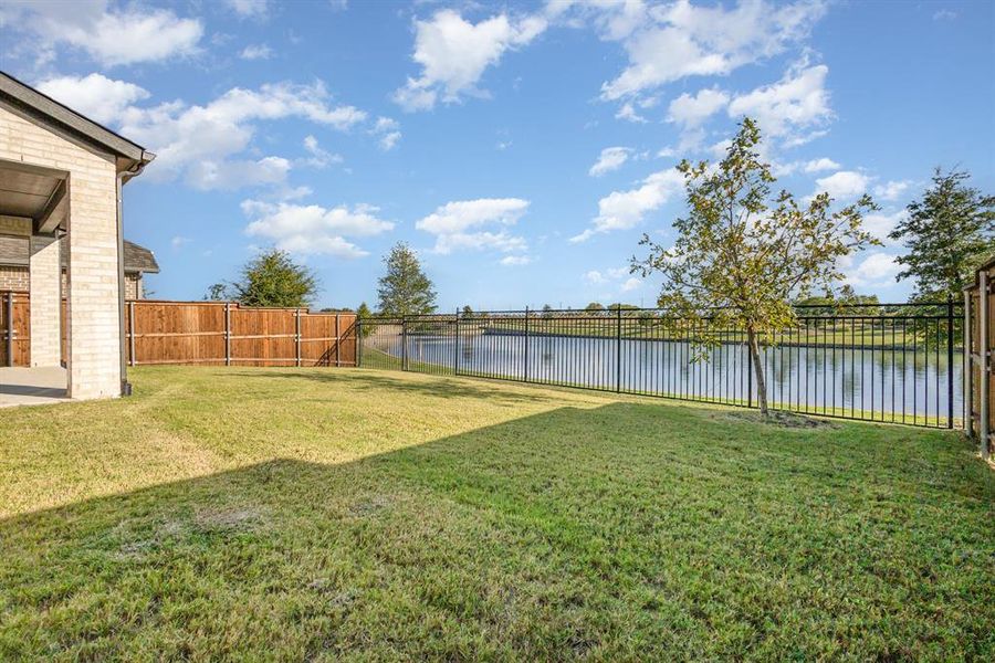 Exterior details and patio area of a home in Cambridge Crossing 50', Celina (Image 15).