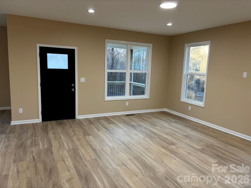 Custom lighting with natural light from numerous windows.