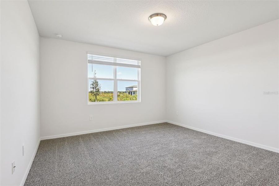 Spacious, unfurnished interior of a new home in Lake Deer Estates - Signature Series, Poinciana (Image 31).