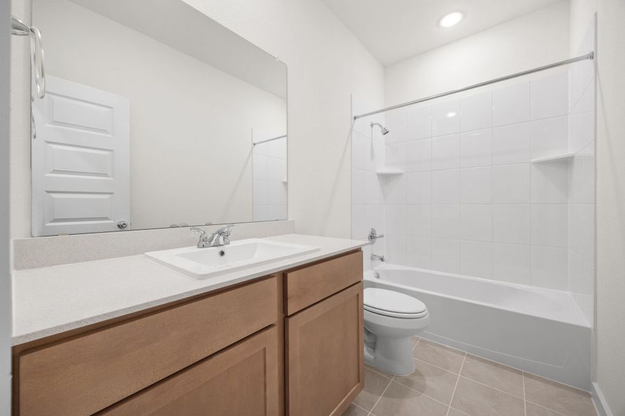 Bathroom in the Turquoise home plan by Trophy Signature Homes – REPRESENTATIVE PHOTO