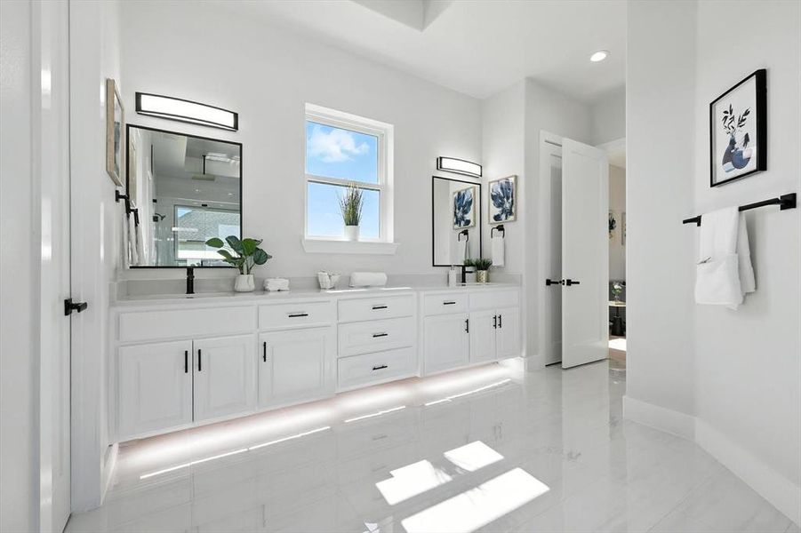 Full bath with double vanity, a shower, and marble finish flooring Full bath with double vanity, a shower, and marble finish flooring