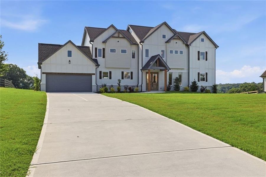 Front exterior of a new home in , Clermont, GA, highlighting curb appeal (Image 2).