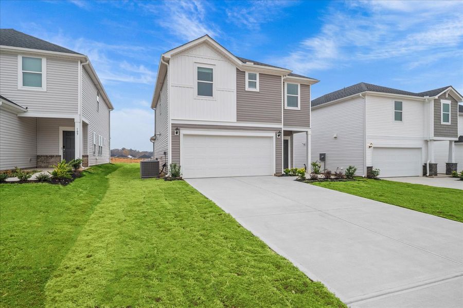 Front exterior of a new home in The Farm at Wells Creek - Heritage Collection, Gray Court, SC, highlighting curb appeal (Image 2).