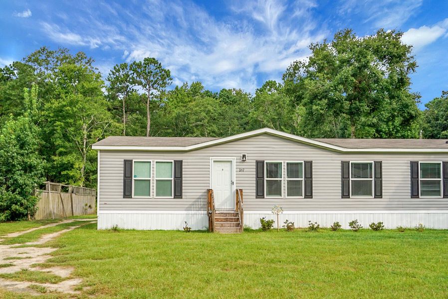 Front exterior of a new home in , Bonneau, SC, highlighting curb appeal (Image 31).