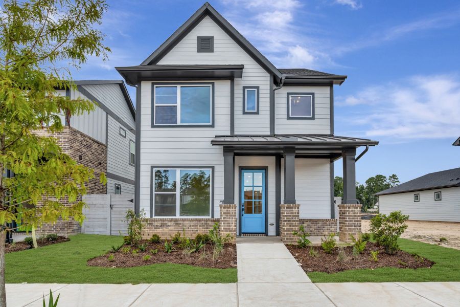 Front exterior of a new home in Two Step Farm - Cottages Row Collection, Montgomery, TX, highlighting curb appeal (Image 2). Front exterior of a new home in Two Step Farm - Cottages Row Collection, Montgomery, TX, highlighting curb appeal (Image 2).