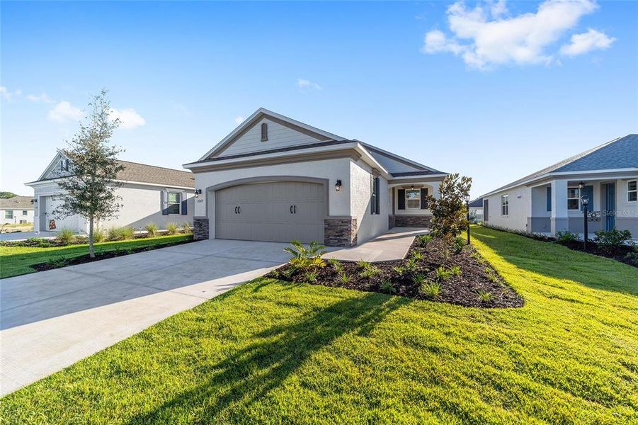 Front exterior of a new home in , Ocala, FL, highlighting curb appeal (Image 1).