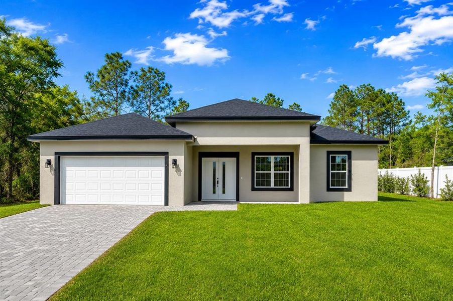 Front exterior of a new home in , Citrus Springs, FL, highlighting curb appeal (Image 1). Front exterior of a new home in , Citrus Springs, FL, highlighting curb appeal (Image 1).