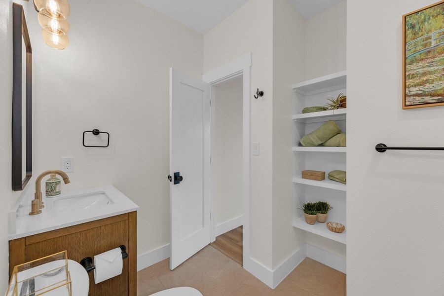 Ensuite bathroom that is also guest bath with entry from the hall.