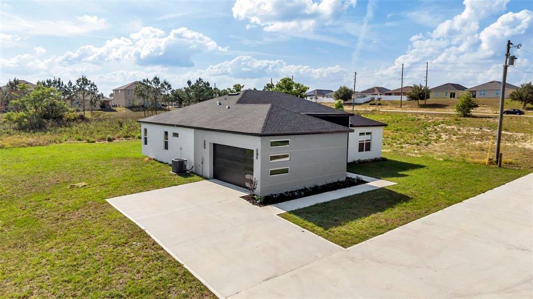Front exterior of a new home in , Davenport, FL, highlighting curb appeal (Image 19).