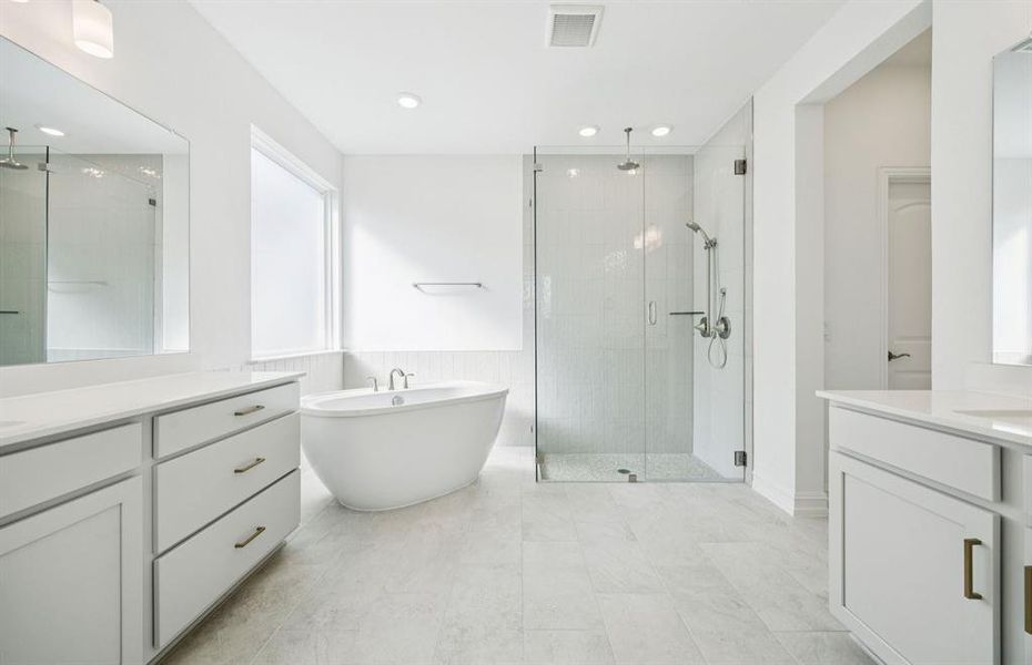 Luxurious owner's bath complete with double sinks and a generous shower Luxurious owner's bath complete with double sinks and a generous shower